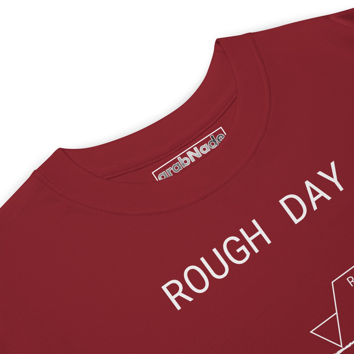 Closeup black heavyweight premium tee with white roughness symbol and "ROUGH DAY (Ra 12.5)" text.