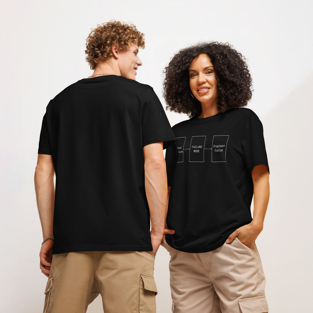 A man backside and a woman frontside in black organic premium tee with white flowchart "FAILURE MODE" design for problem solvers.