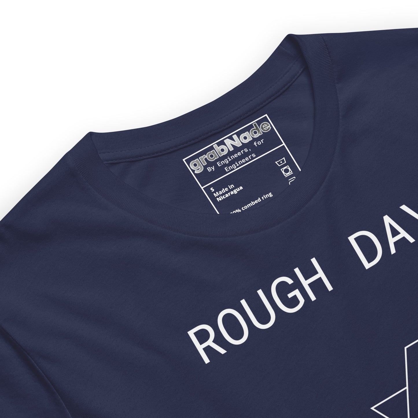 Closeup navy premium tee with white roughness symbol and "ROUGH DAY (Ra 12.5)" text.