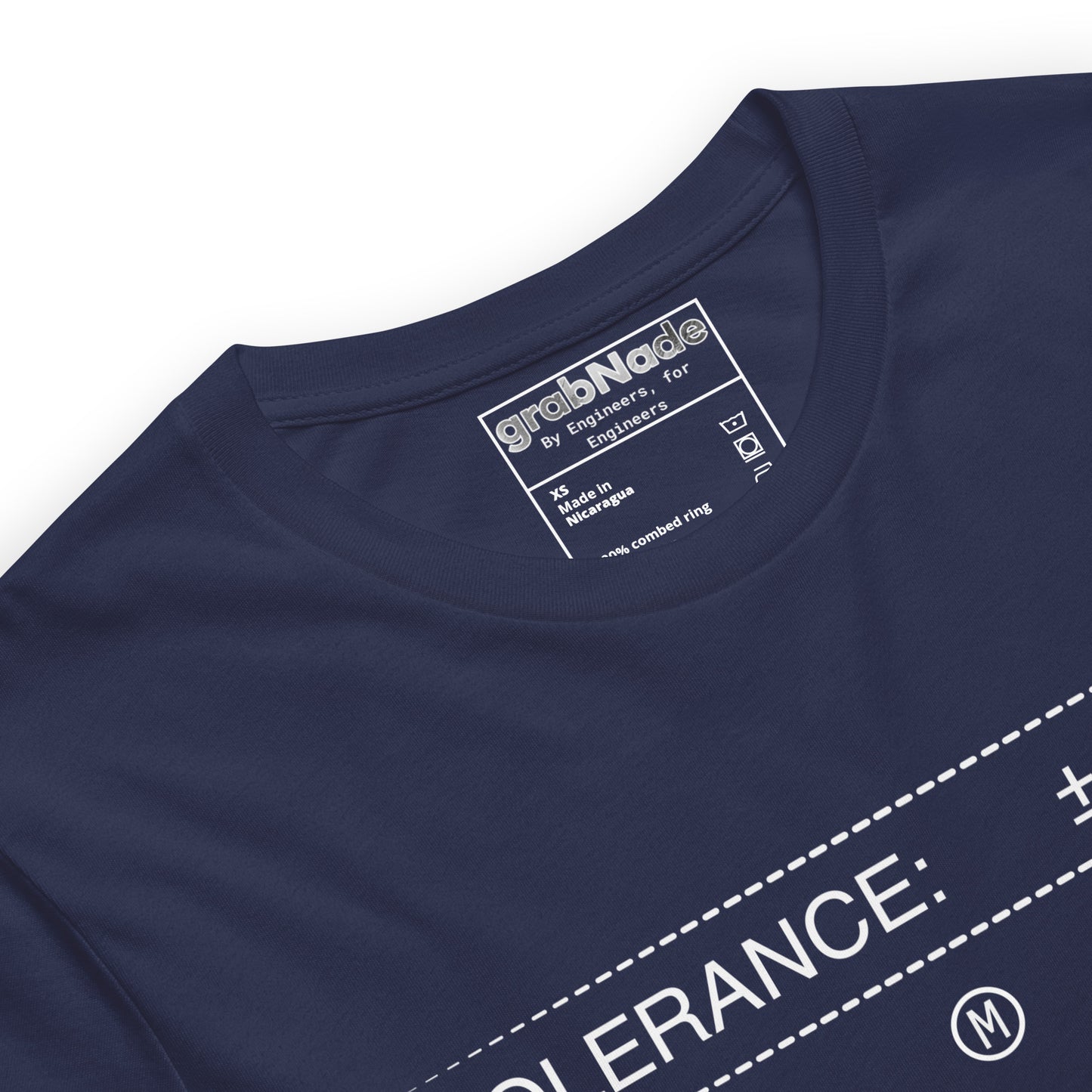 Closeup black premium t-shirt with white text "TOLERANCE: ±.0002" for mechanical engineers.