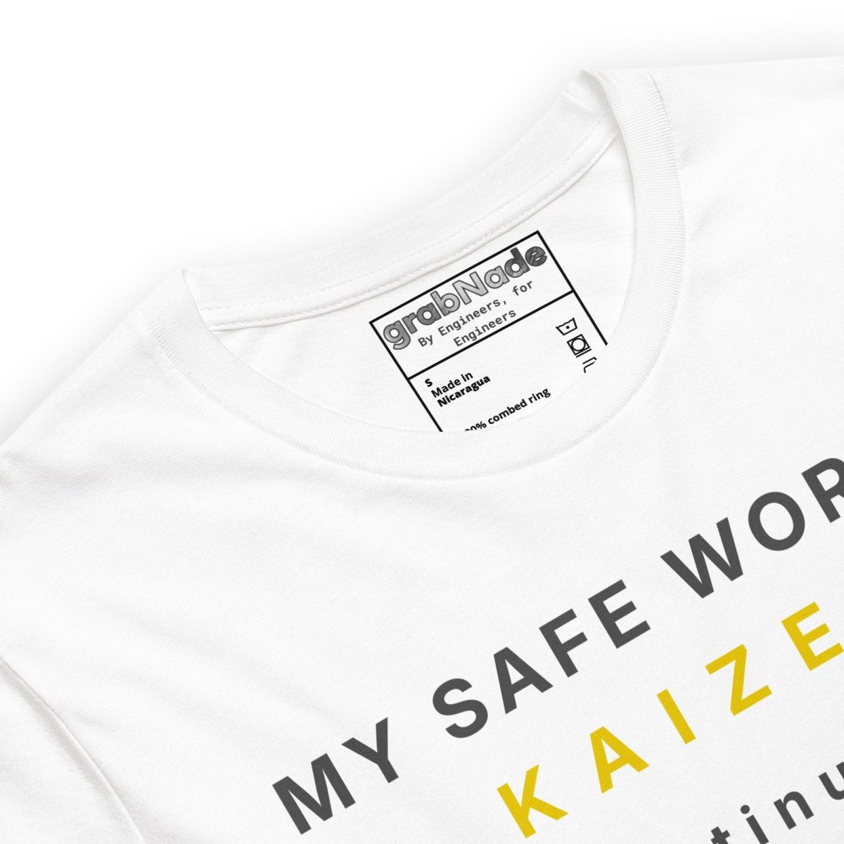 Close up of white t-shirt featuring "My safe word is Kaizen" with Japanese kanji and continuous improvement text.