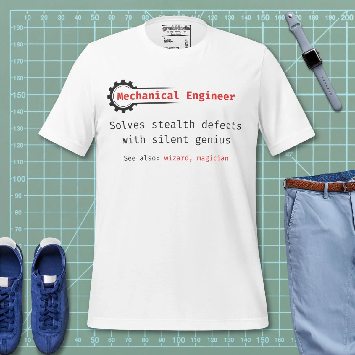 White t-shirt with "Mechanical Engineer. Solves stealth defects... See also: wizard" definition.