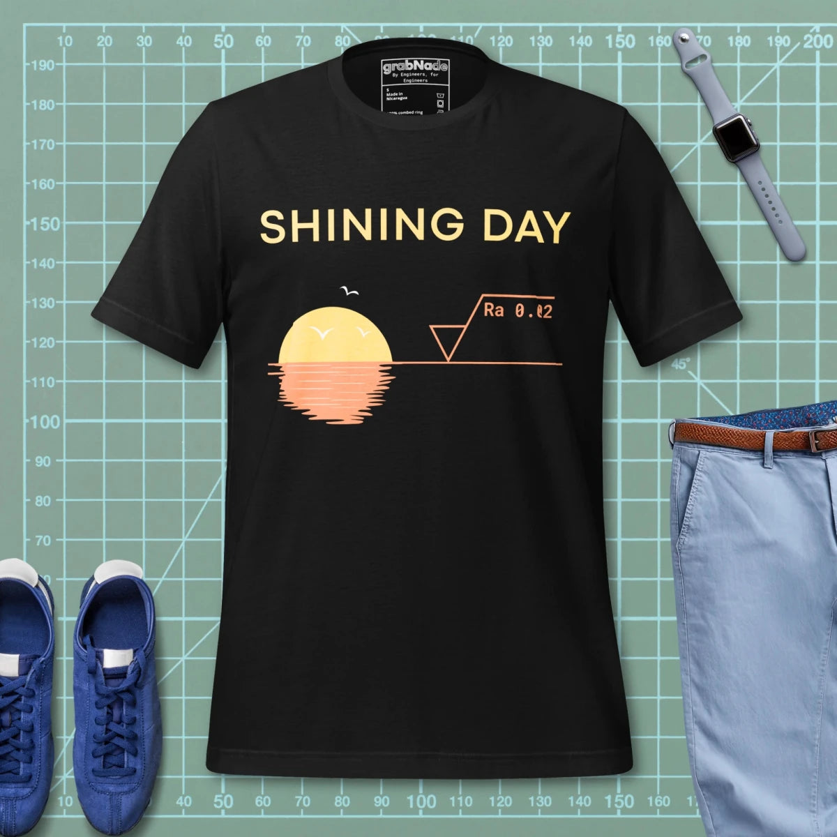 Black t-shirt featuring an Ra0.02 surface finish symbol on a geometric sunset horizon line.