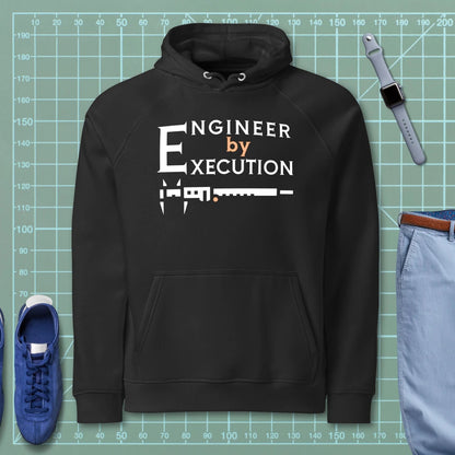 Black organic fleece hoodie “Engineer by Execution” with a caliper.