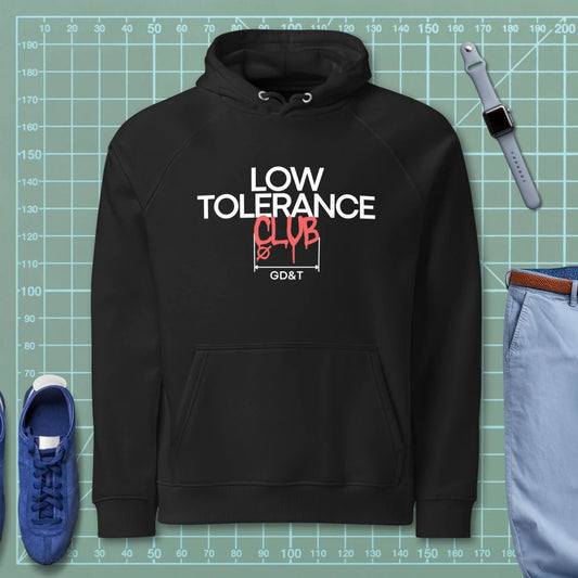 Black hoodie with "LOW TOLERANCE CLUB" dripping precision tolerance numbers graphic.