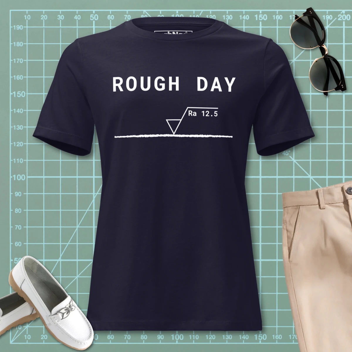 STEM women's cut, navy t-shirt featuring "Rough Day" text and an Ra 12.5 surface finish symbol.
