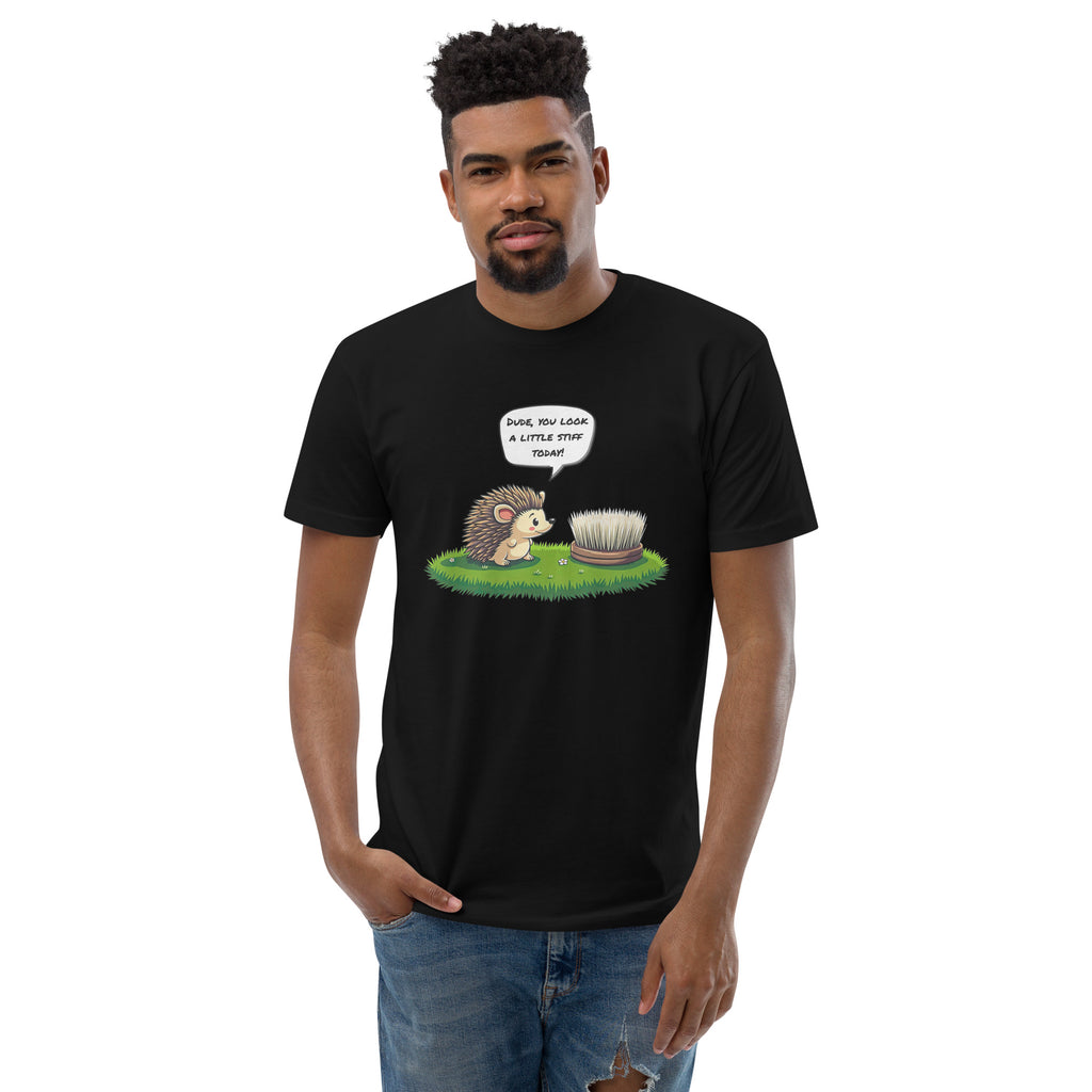 Product mockup. Man with short hair and beard wearing a black fitted t-shirt and black pants with a cartoon hedgehog and "Dude, you look a little stiff today!" caption.