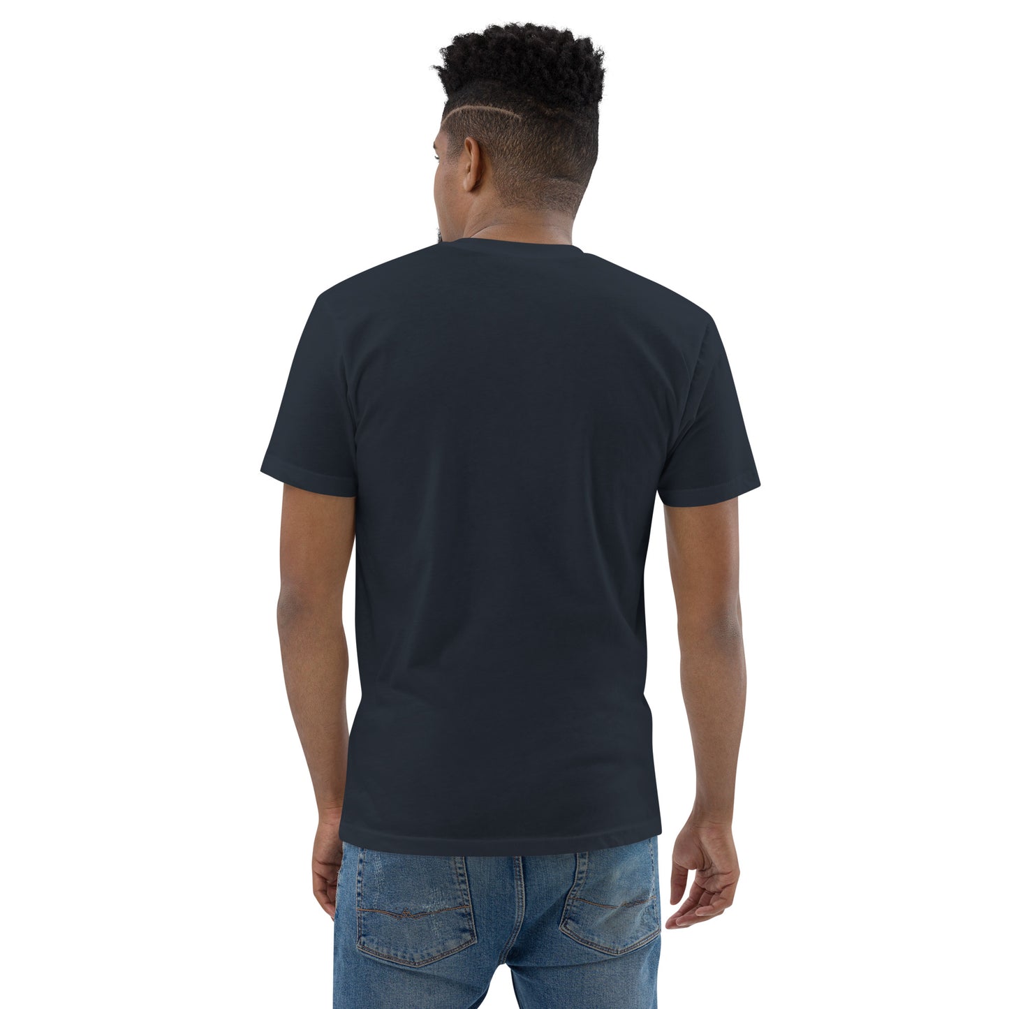 Product mockup. Man with short curly hair wearing a plain midnight navy t-shirt and blue jeans, back view.