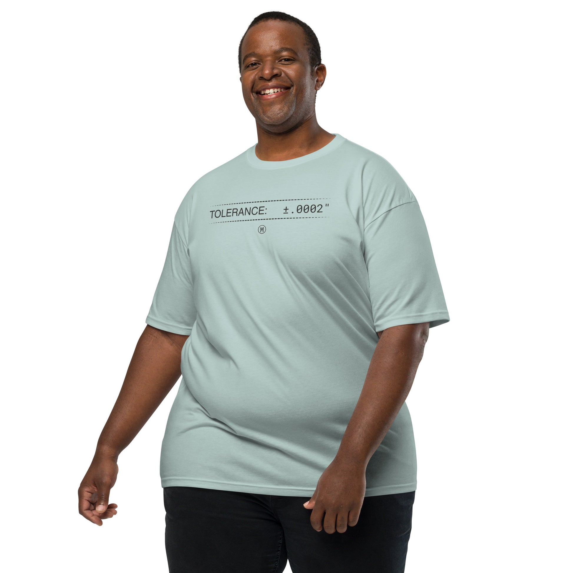 2XL man in heavyweight blue premium t-shirt with text "TOLERANCE: ±.0002" for mechanical engineers.