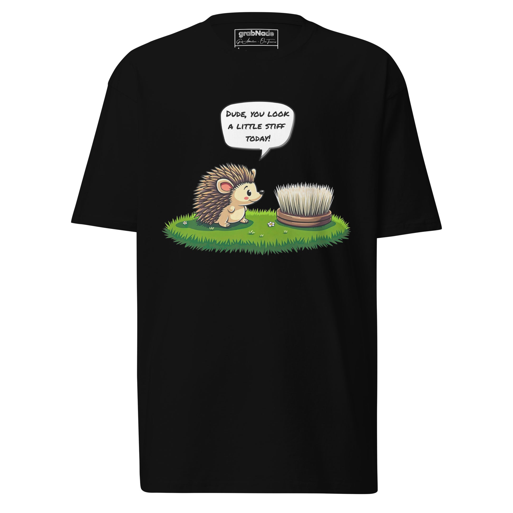 The grabNade Men's Relaxed Heavyweight Tee is a premium cotton shirt featuring a cartoon hedgehog telling a round brush, “Dude you look a little stiff today!”—a humorous nod to their spiky similarities.