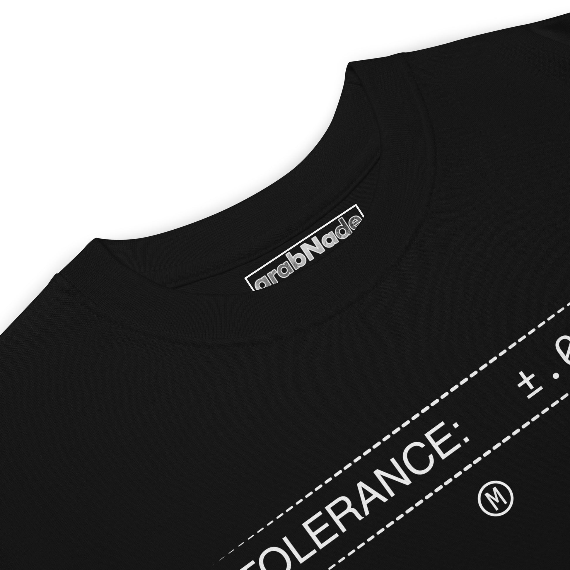Closeup heavyweight black premium t-shirt with white text "TOLERANCE: ±.0002" for mechanical engineers.