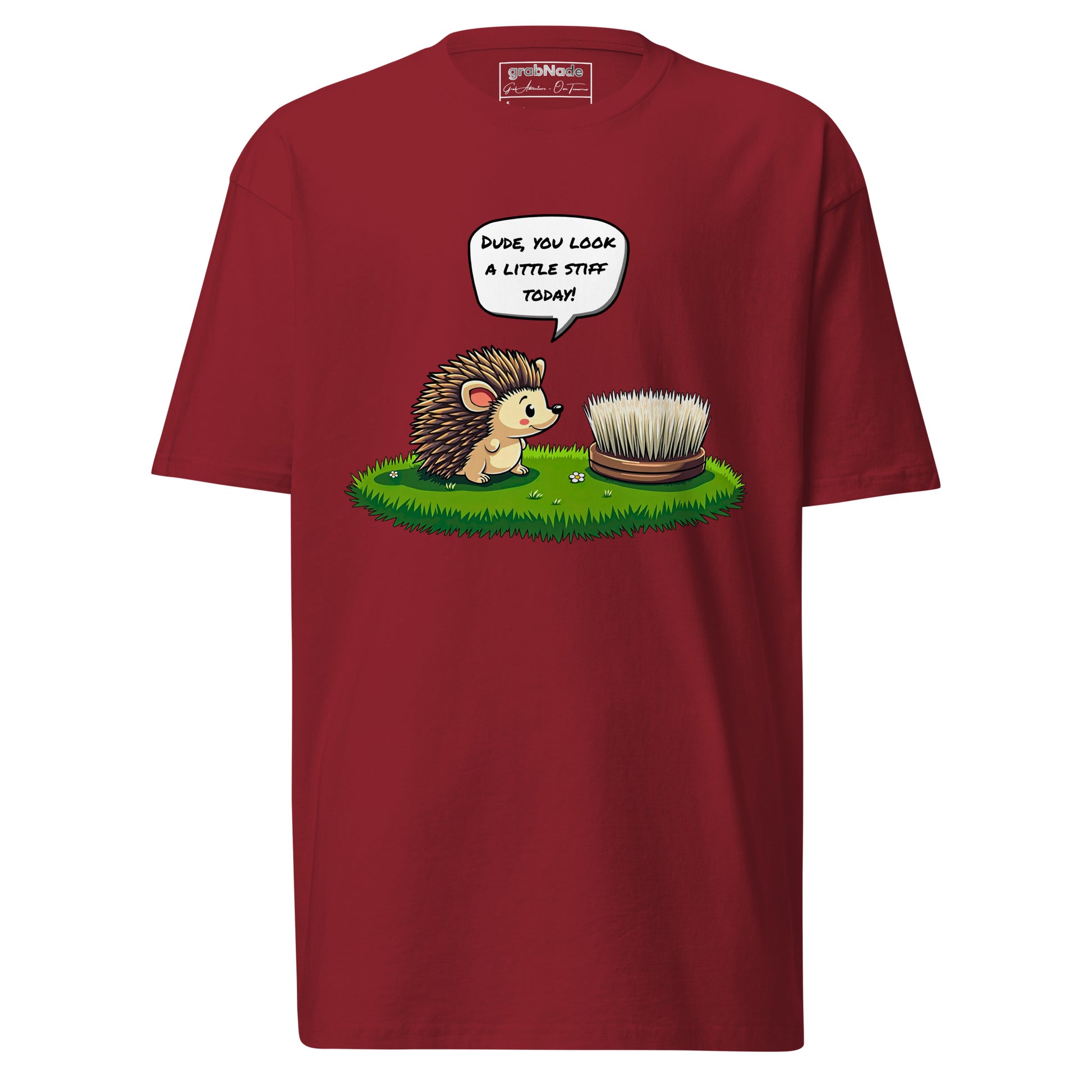 The grabNade Men's Relaxed Heavyweight Tee features premium cotton and a cartoon hedgehog eyeing a hairbrush on grass with the pun, "Dude, you look a little stiff today!" for playful comfort in a modern fit.