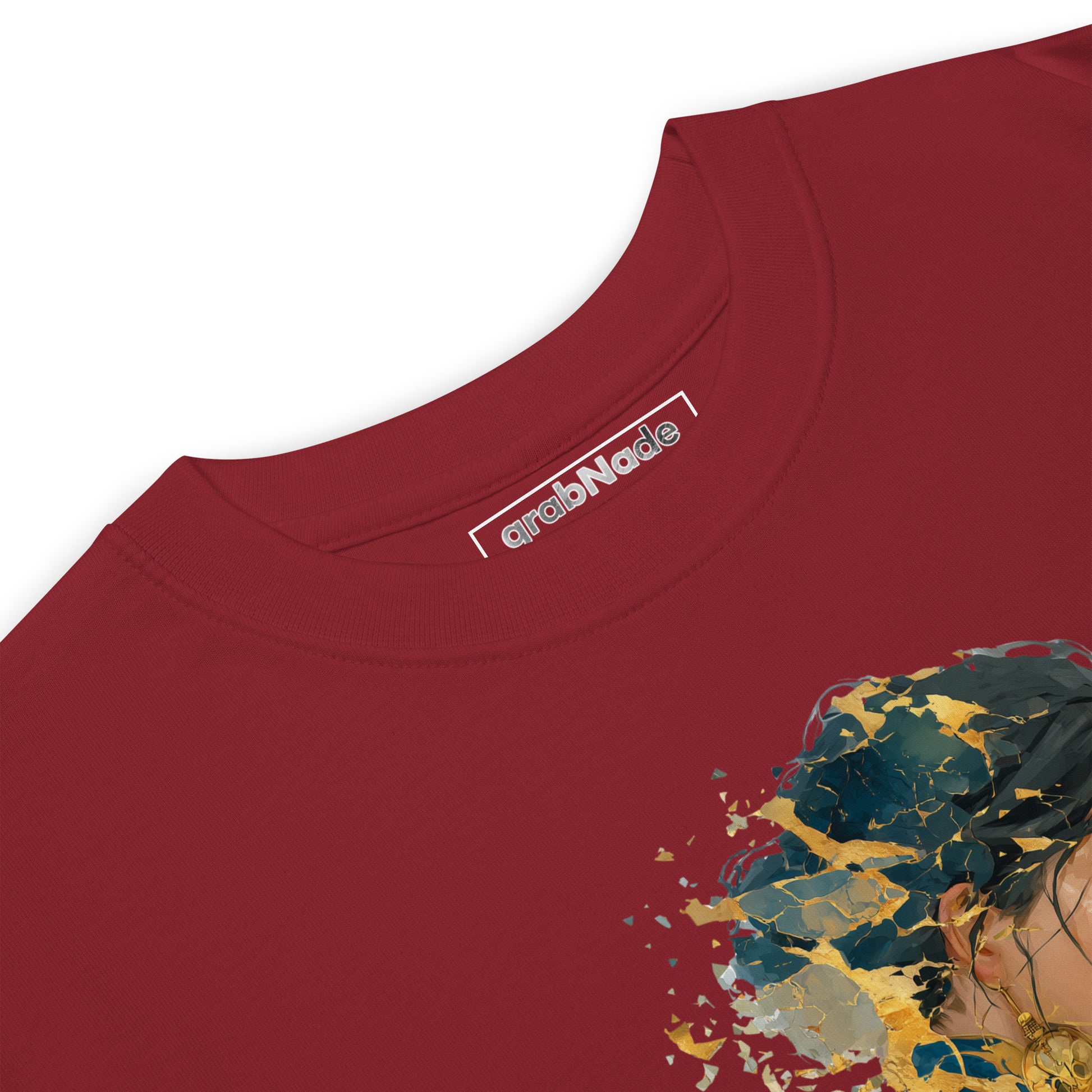 Product mockup. Closeup of the neck and collar label of a brick-red t-shirt showing the grabNade brand and part of a cartoon hedgehog with the caption "Dude, you look a little stiff today!"