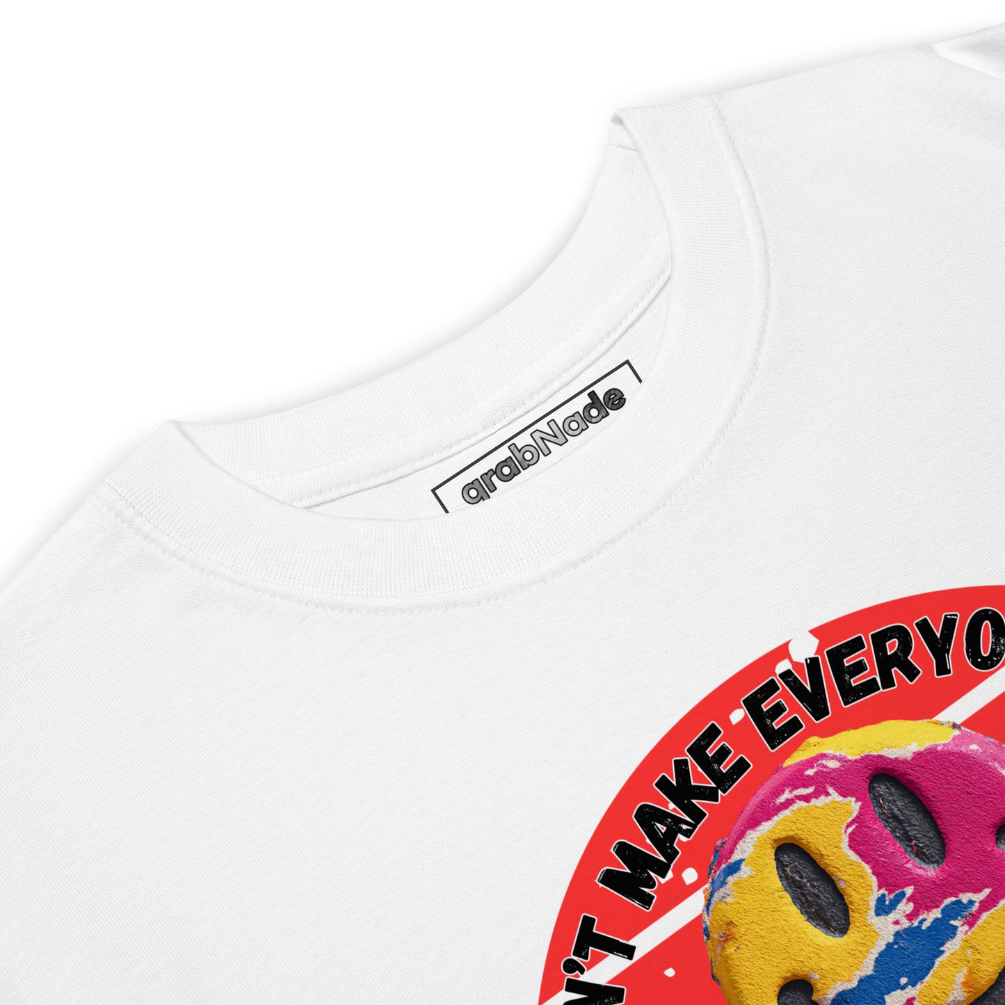 Product mockup. Closeup of the neck and collar label of a white t-shirt showing the grabNade brand and part of a large colorful smiley face with rainbow stripes.
