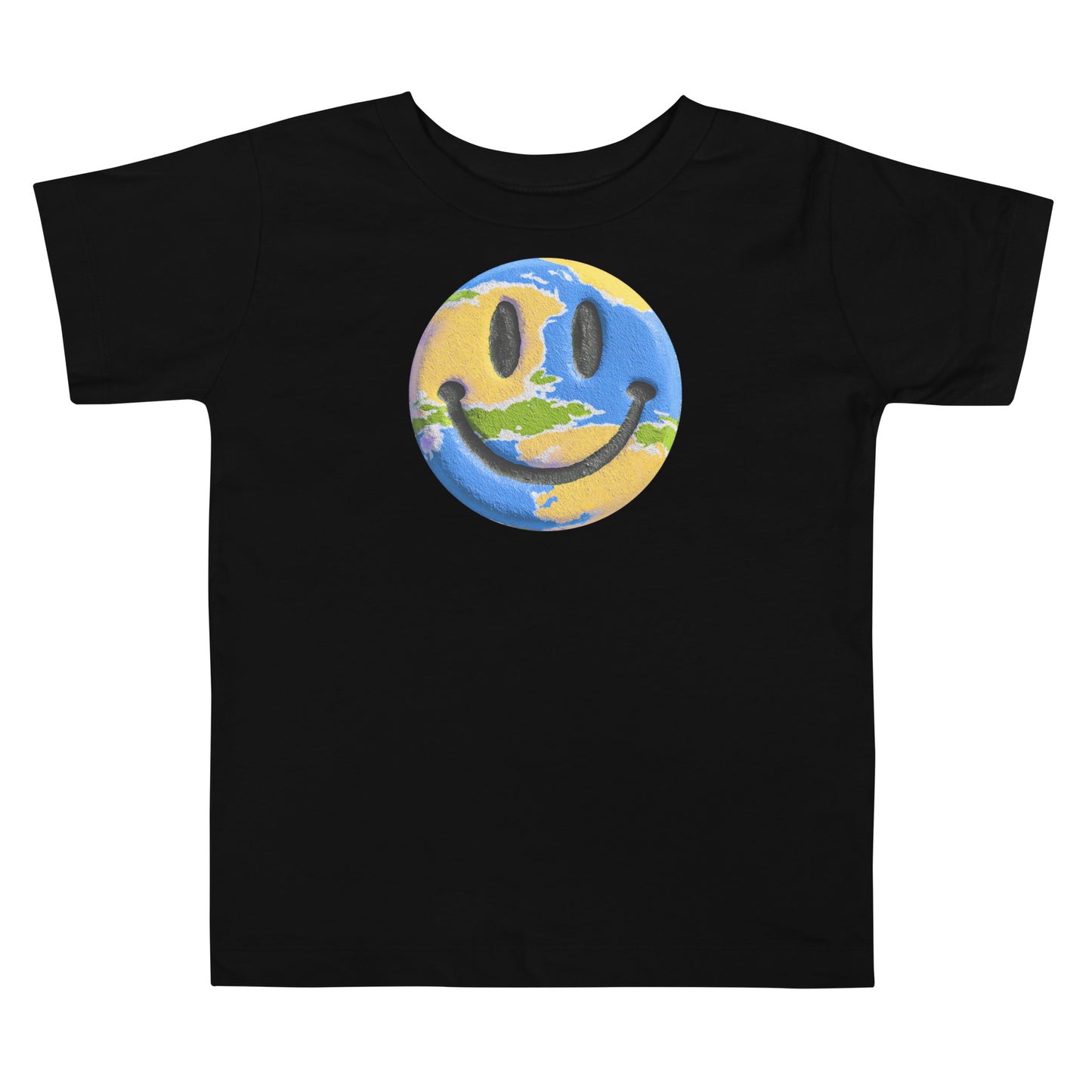 Product mockup. Toddler standing, wearing a black t-shirt with a blue, yellow, and green smiley face centered on the chest.