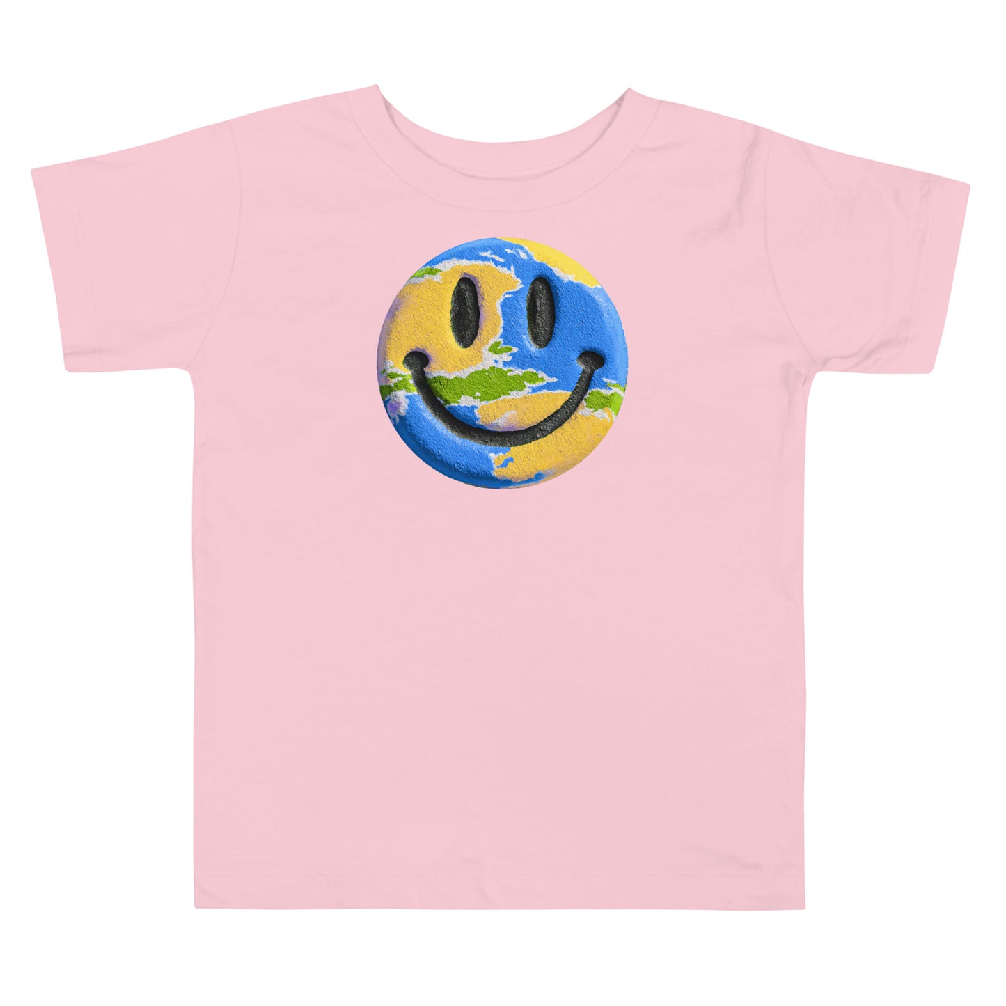 Product mockup. Toddler's light pink t-shirt laid flat, centered with a blue, yellow, and green smiley face graphic.