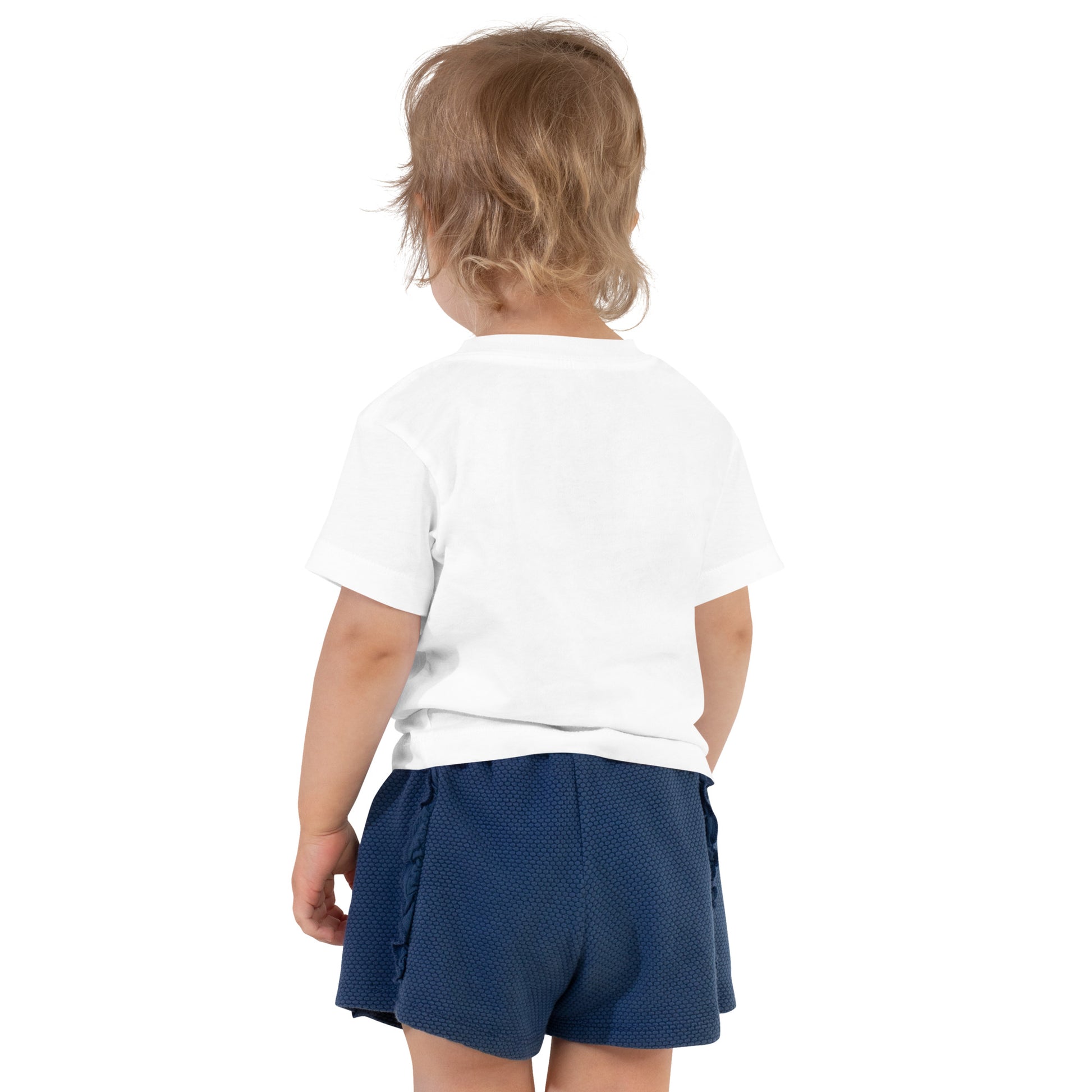 Product mockup. Toddler shown from behind, wearing a plain white t-shirt and blue shorts.