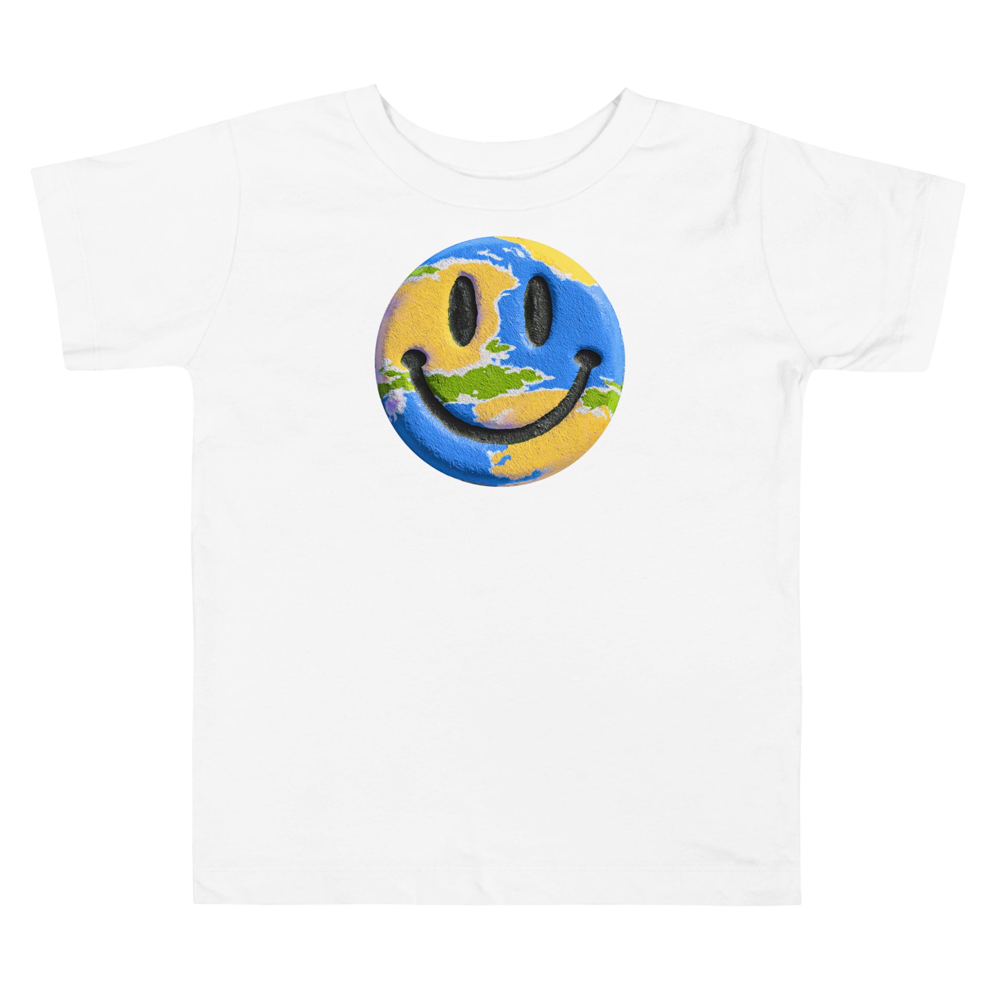 Product mockup. Toddler standing, wearing a white t-shirt with a large blue, yellow, and green smiley face icon, and blue jeans.