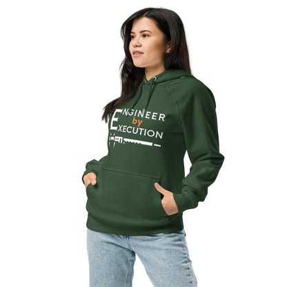 Woman in green organic fleece hoodie “Engineer by Execution” with a caliper.
