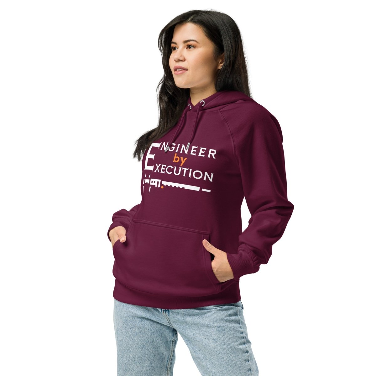 Woman in red organic fleece hoodie “Engineer by Execution” with a caliper.