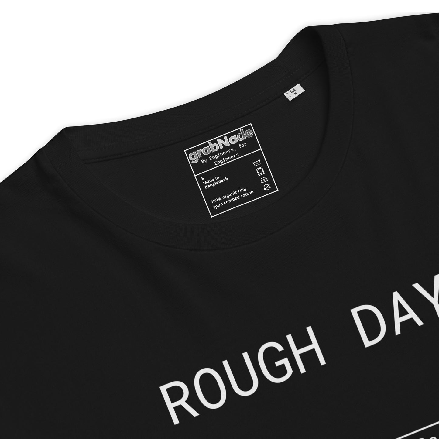 Closeup of black GOTS organic tee with white roughness symbol and "ROUGH DAY (Ra 12.5)" text.