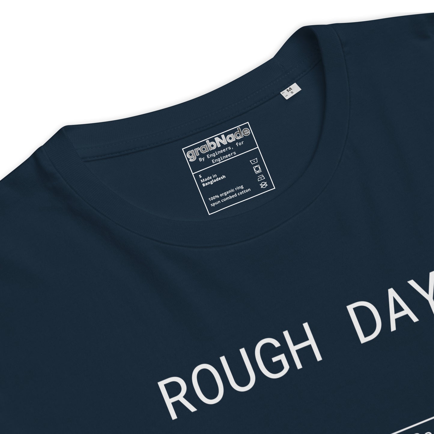 Closeup of navy GOTS organic tee with white roughness symbol and "ROUGH DAY (Ra 12.5)" text.