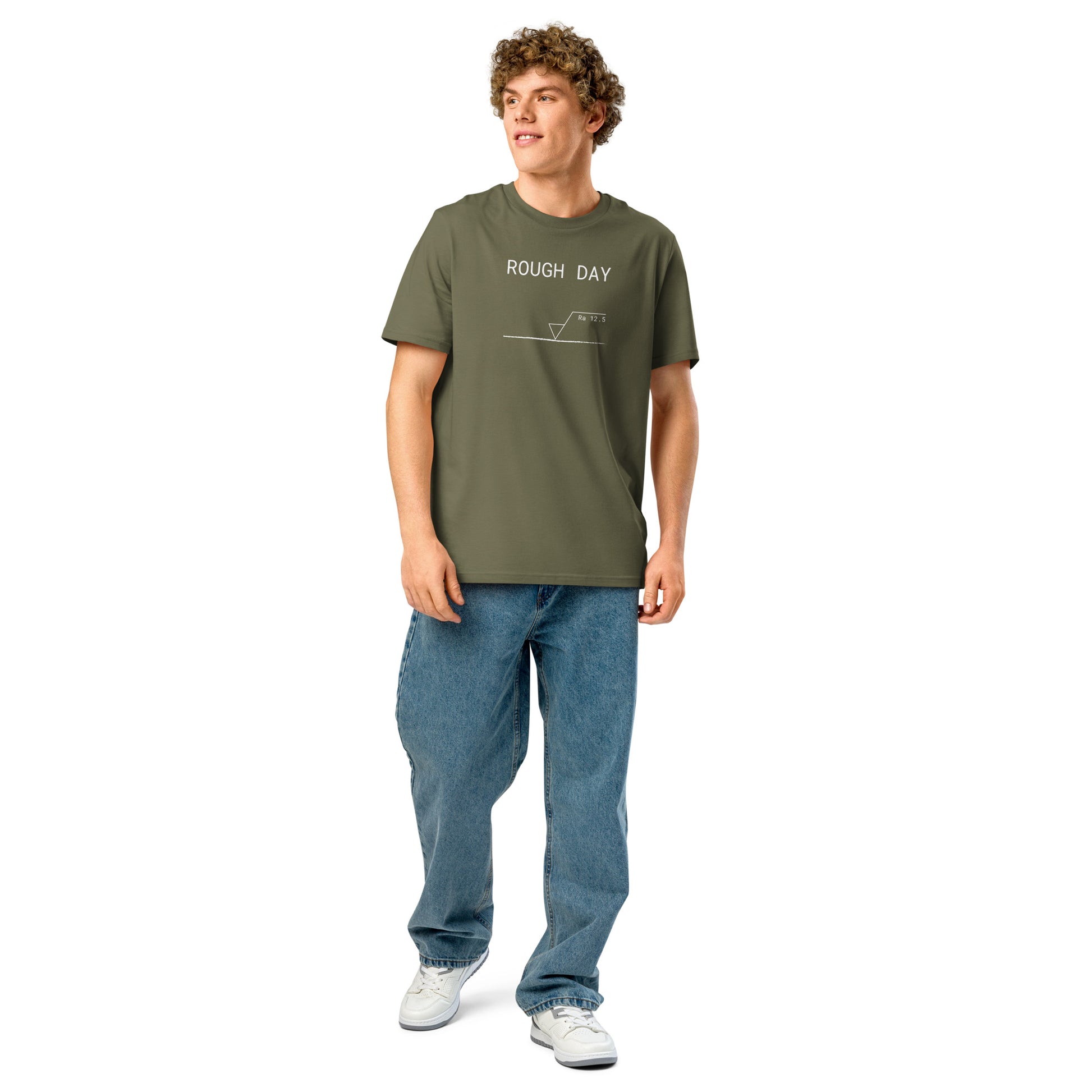 Man wearing green GOTS organic tee with white roughness symbol and "ROUGH DAY (Ra 12.5)" text.