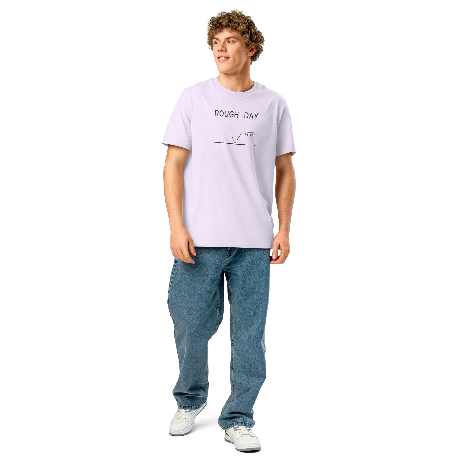 Man wearing lavender GOTS organic tee with roughness symbol and "ROUGH DAY (Ra 12.5)" text.