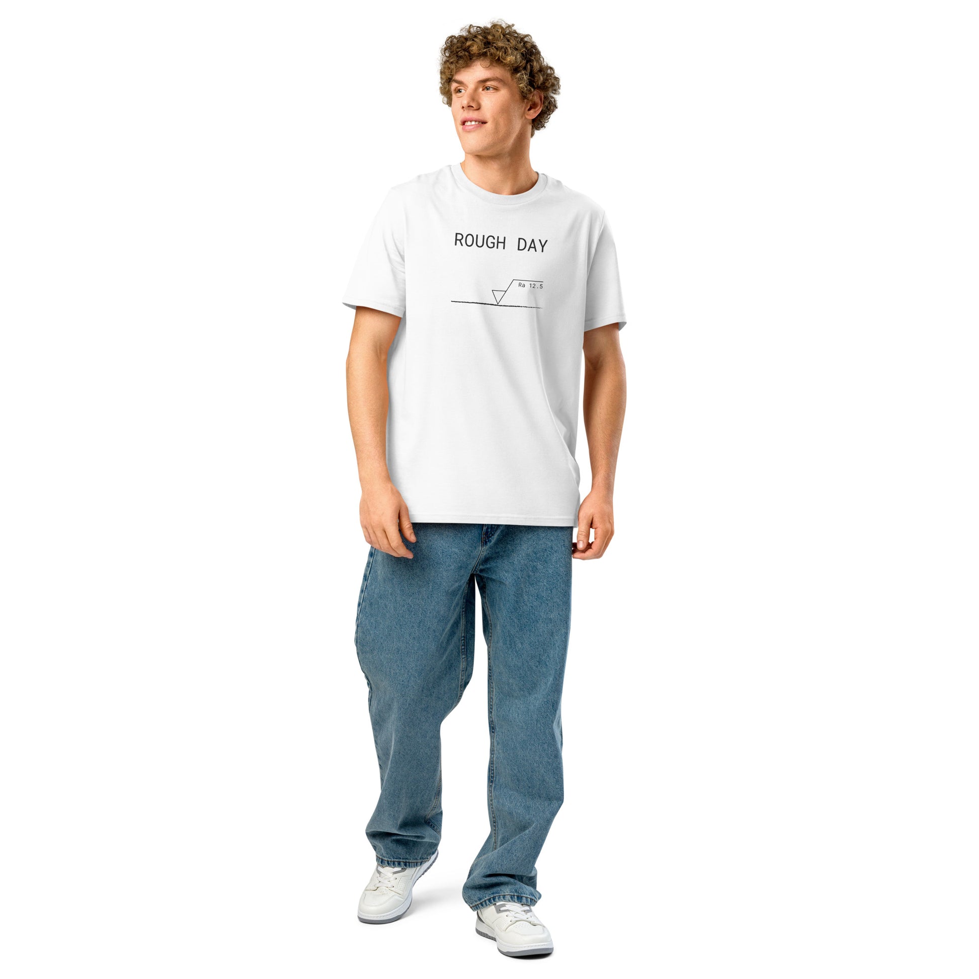 Man wearing white GOTS organic tee with roughness symbol and "ROUGH DAY (Ra 12.5)" text.