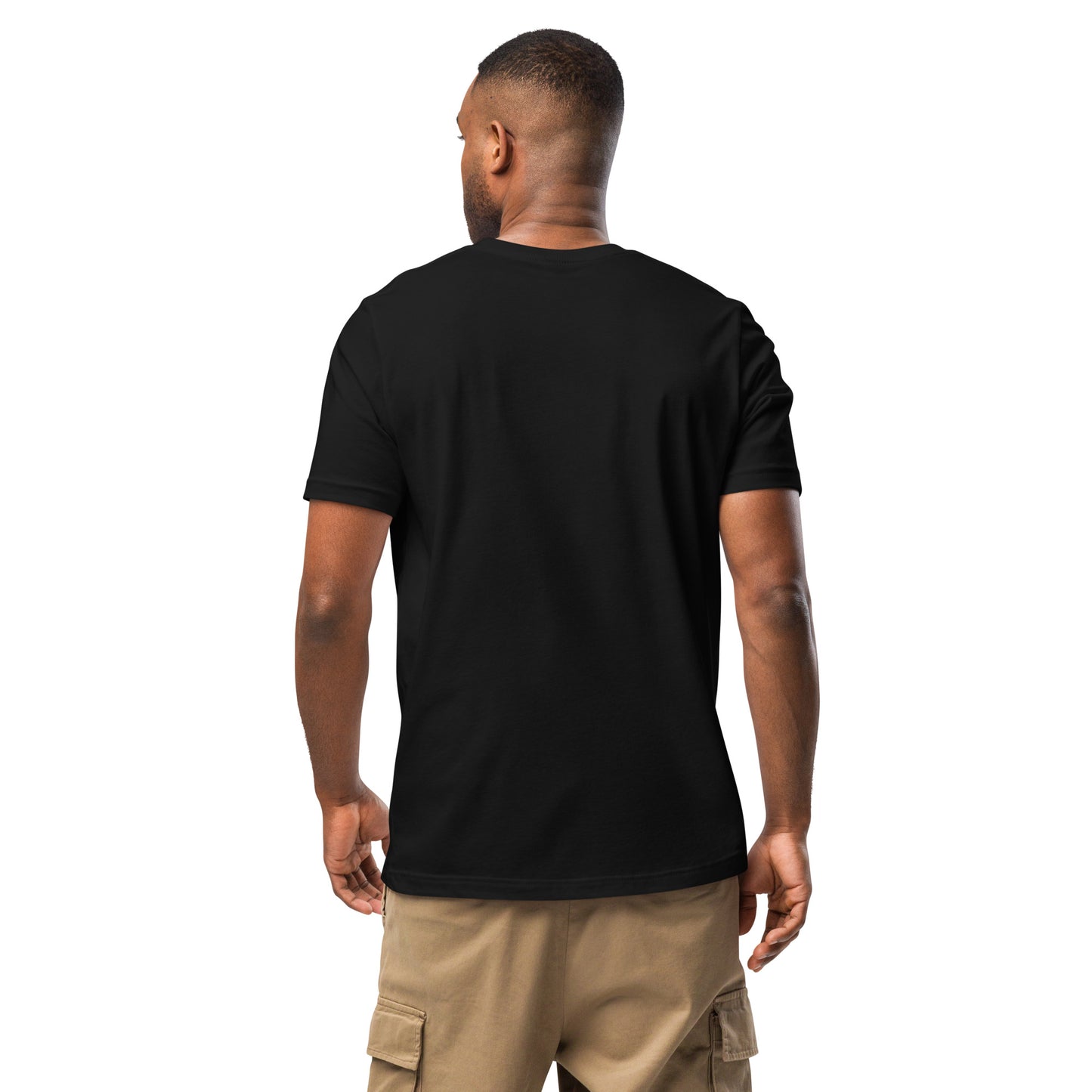 Product mockup. Man standing with his back to the camera, wearing a plain black t-shirt and tan cargo pants.