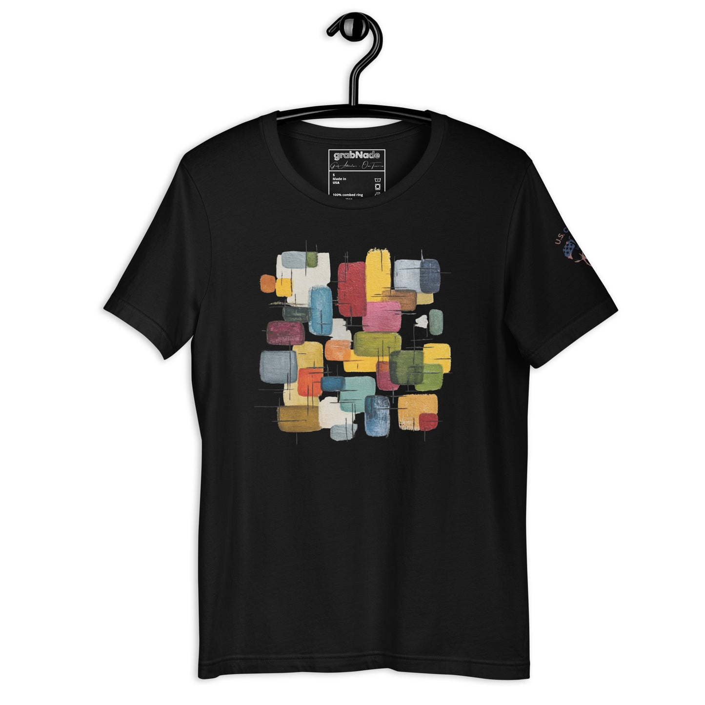 Product mockup. Black t-shirt on a hanger, featuring an abstract geometric block pattern in various colors on the chest.