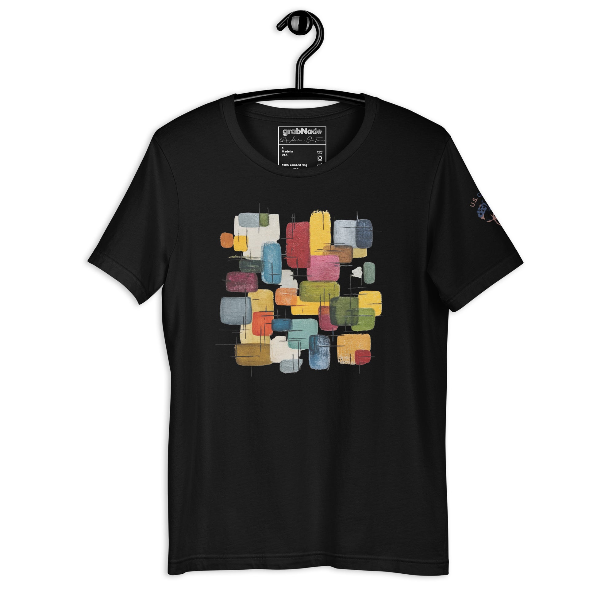 Product mockup. Black t-shirt on a hanger, featuring an abstract geometric block pattern in various colors on the chest.