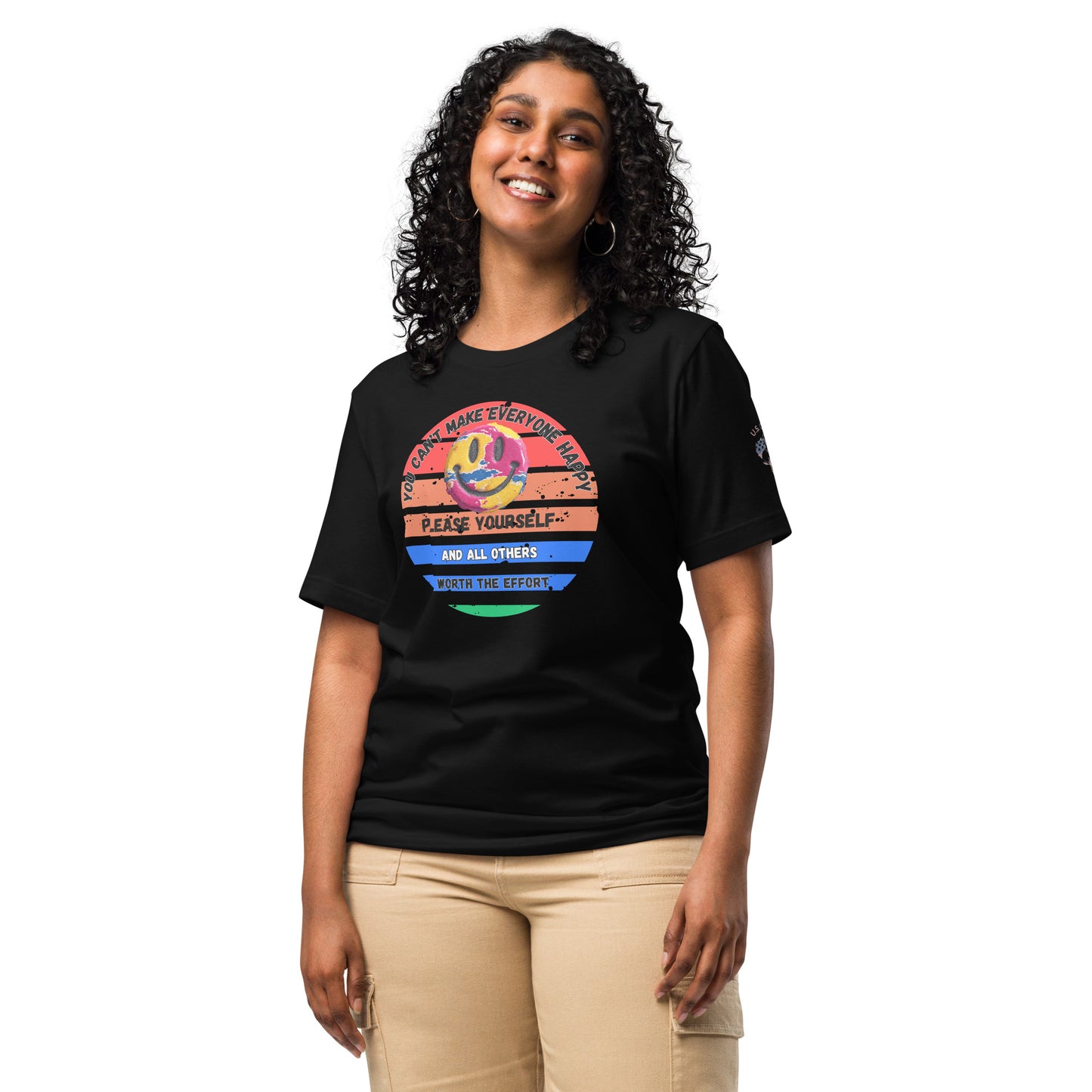 Product mockup. A woman stands wearing a black t-shirt with a large circular rainbow-striped graphic featuring a smiley face and layered inspirational text.