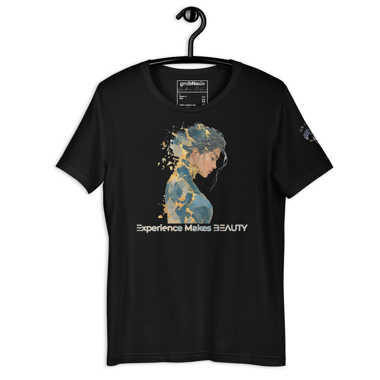 Product mockup. Black t-shirt on a hanger with a blue and yellow abstract silhouette artwork of a woman and "Experience Makes BEAUTY" printed underneath.