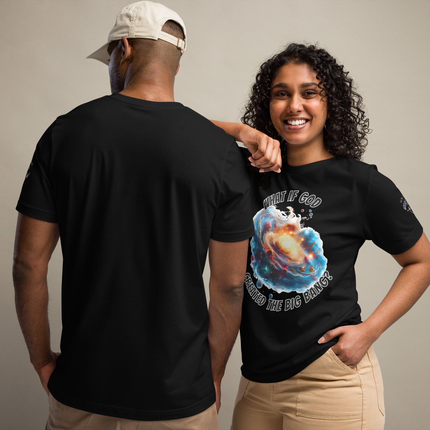 Product mockup. Man and woman; woman in black T-shirt with "What if God created the big bang?" design, man in plain black shirt back view.