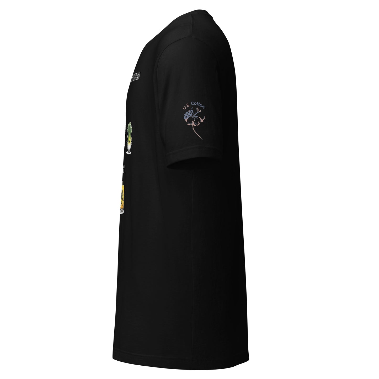 Product mockup. Left-side view of a black t-shirt featuring "U.S. Cotton" badge on the sleeve, with cartoon vegetables and BBQ text partially visible on the front.
