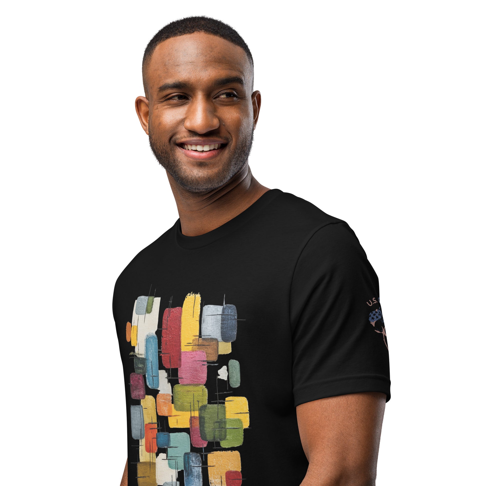 Product mockup. A man wears a black t-shirt with a vertically stacked pattern of colorful abstract rectangles and a "U.S. Cotton" badge on the sleeve.
