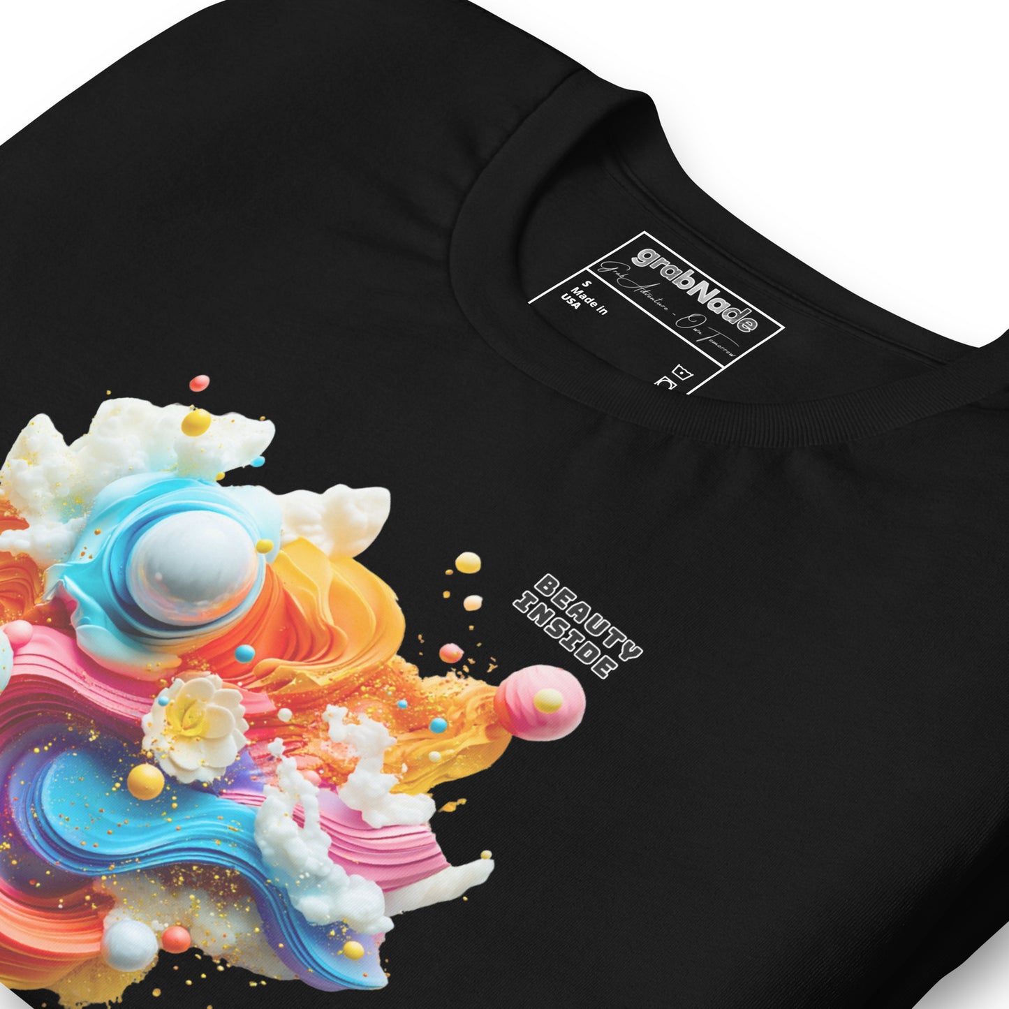 Product mockup. Close-up of a black t-shirt with an abstract, colorful 3D swirl design and the words "BEAUTY INSIDE."