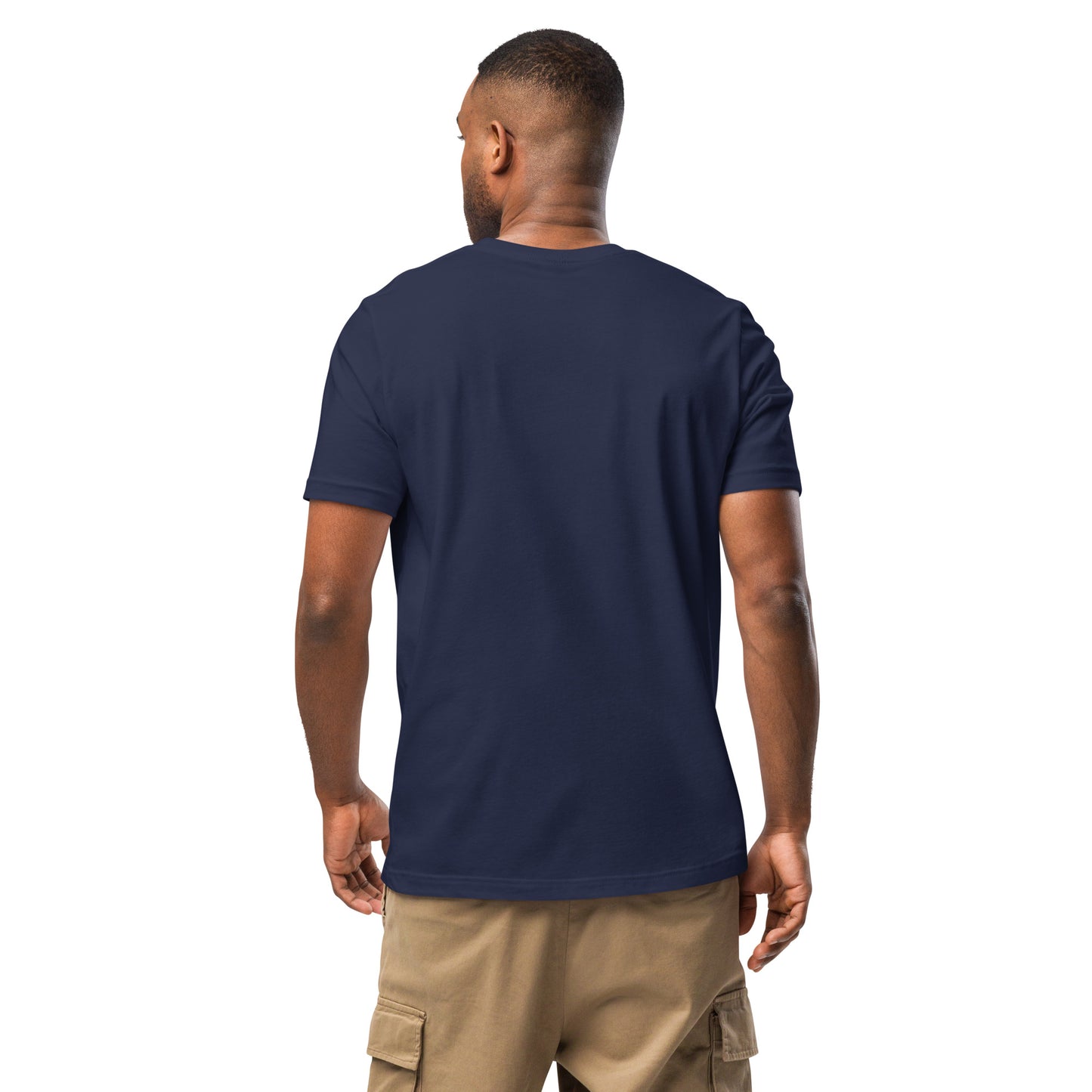 Product mockup. Man shown from the back, wearing a navy blue t-shirt and beige cargo pants, left hand slightly bent.