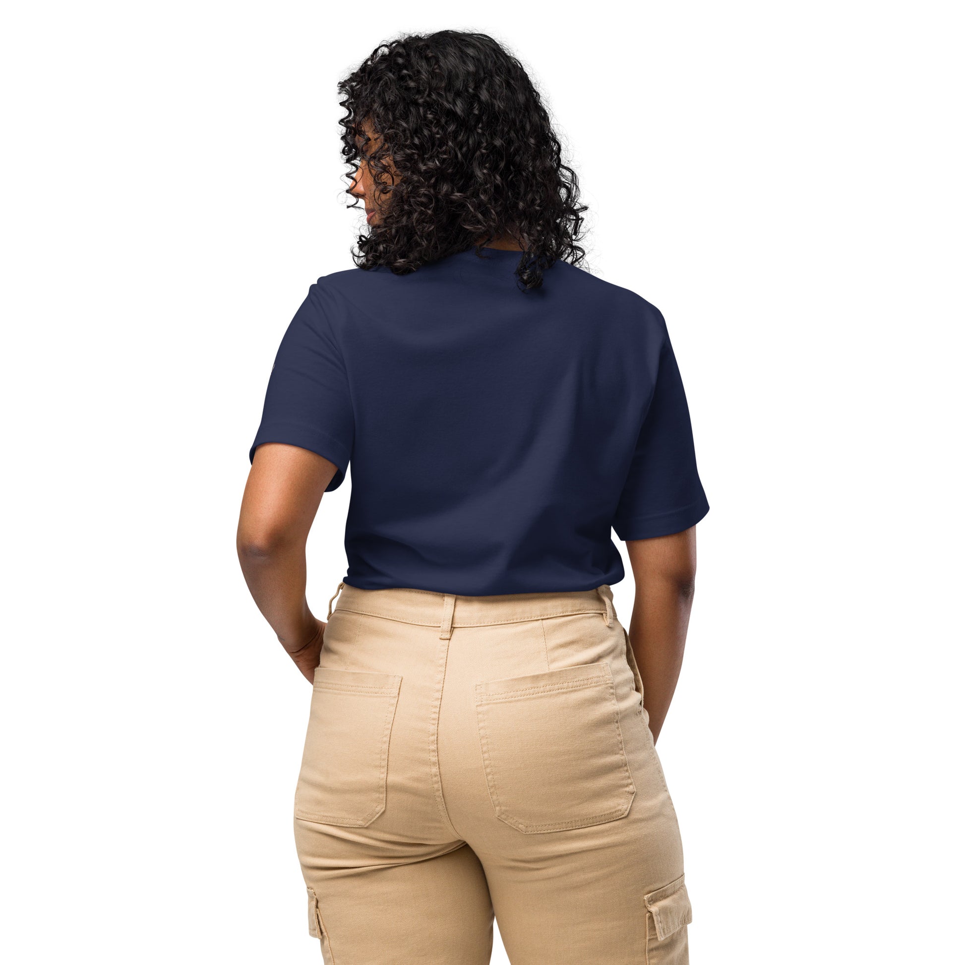Product mockup. Woman with curly hair shown from the back, wearing a plain navy blue T-shirt and beige cargo pants.