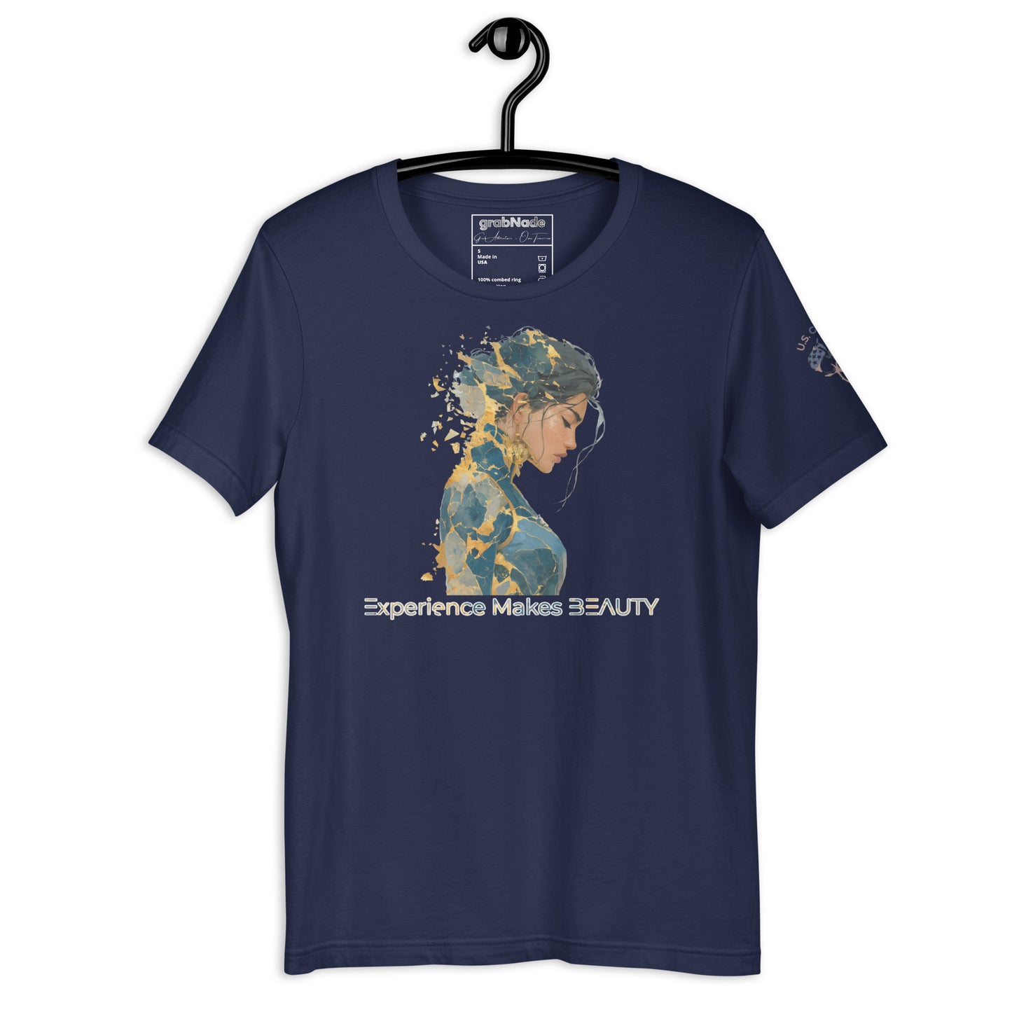 Product mockup. Navy blue t-shirt on a hanger, featuring a blue and gold stylized woman’s portrait and the phrase “Experience Makes BEAUTY”.