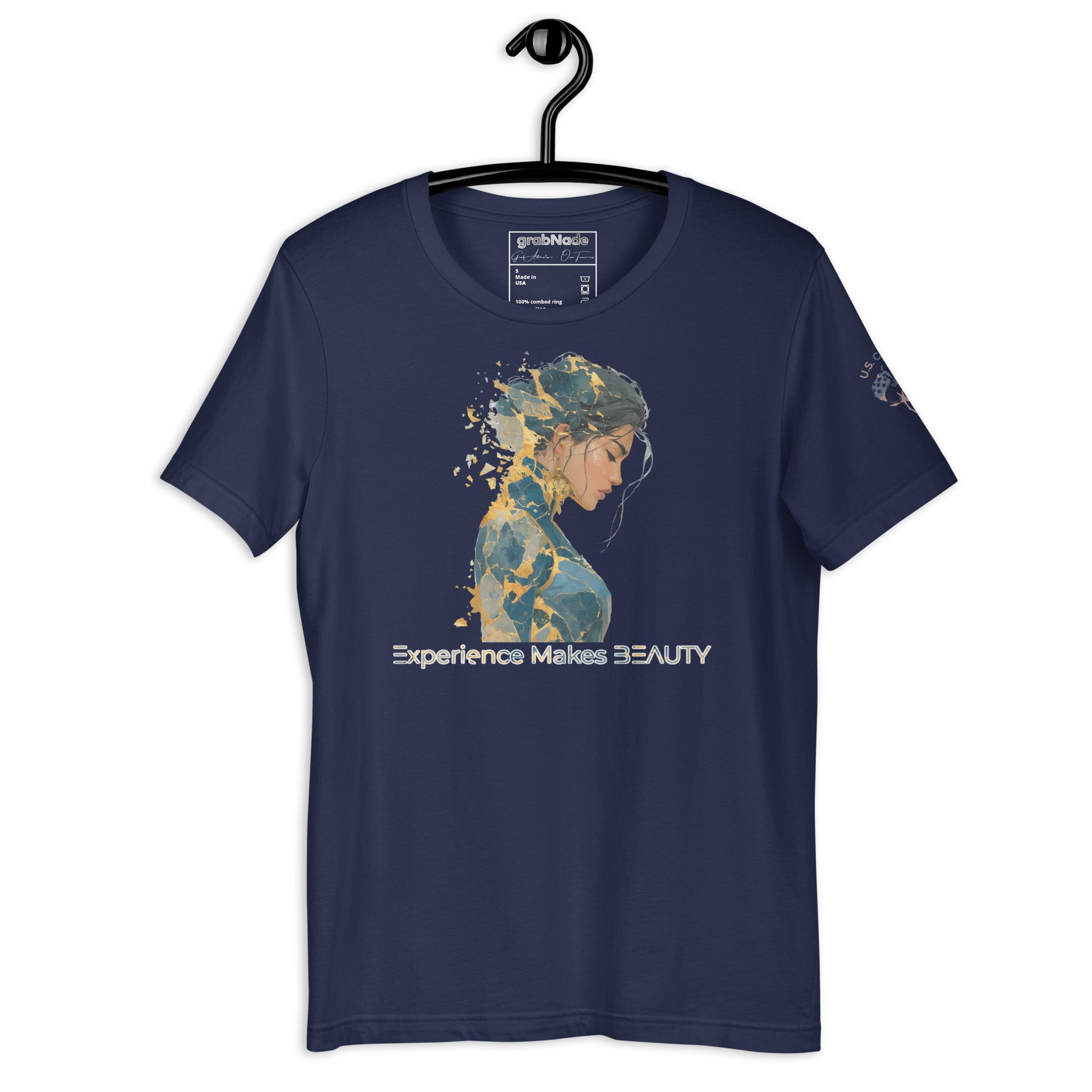 Product mockup. Navy blue t-shirt on a hanger, featuring a blue and gold stylized woman’s portrait and the phrase “Experience Makes BEAUTY”.