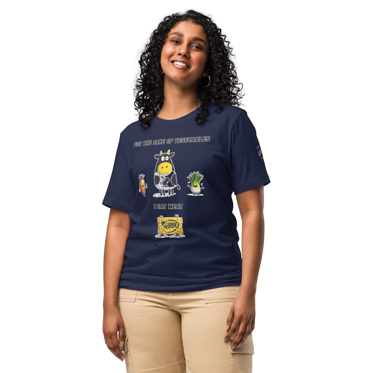 Product mockup. Smiling woman in beige pants and navy blue t-shirt with a cartoon cow, carrot, and lettuce, text: “FOR THE SAKE OF VEGETABLES I EAT MEAT”, and a BBQ sign.