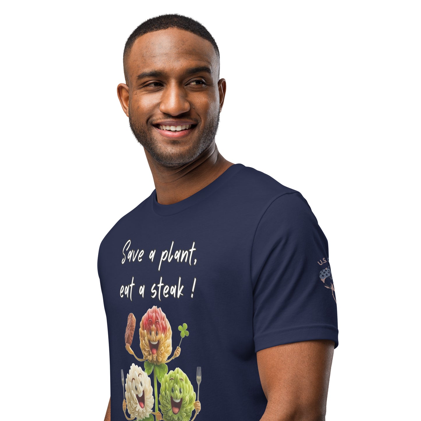 Product mockup. Smiling man wearing a navy blue T-shirt showing three cartoon clovers, one holding steak, with the text "Save a plant, eat a steak!".