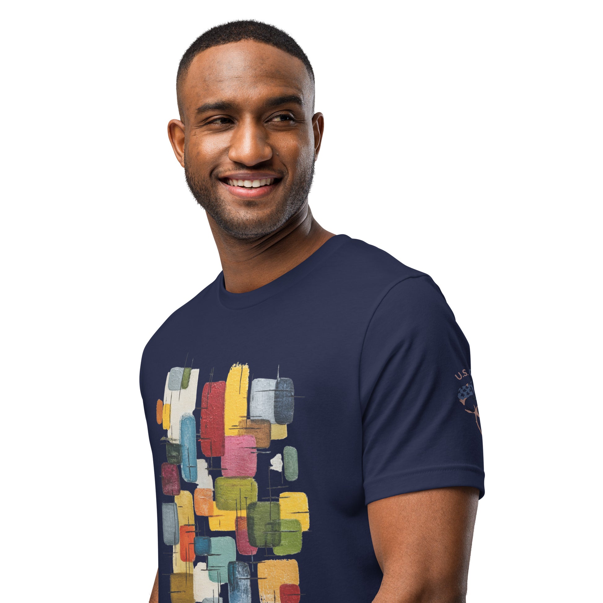 Product mockup. Smiling man wearing a navy blue T-shirt with an abstract multicolor geometric paint pattern graphic on the chest.
