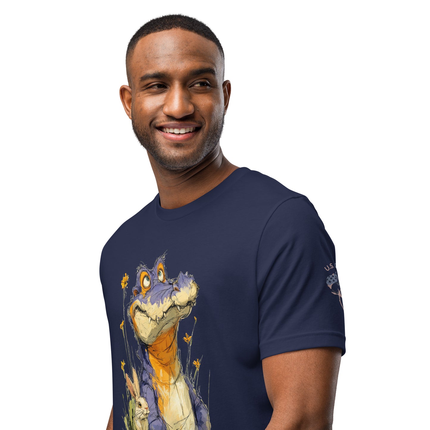 Product mockup. Smiling man wearing a navy blue T-shirt with a large cartoon purple alligator and rabbit amid wildflowers.