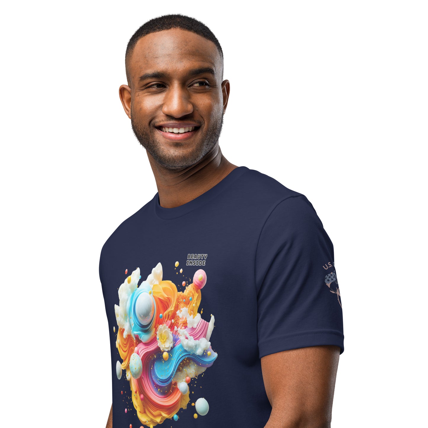 Product mockup. Smiling man wearing a navy blue T-shirt with a bold, multi-color 3D abstract design of swirls, planets and the phrase "BEAUTY INSIDE."