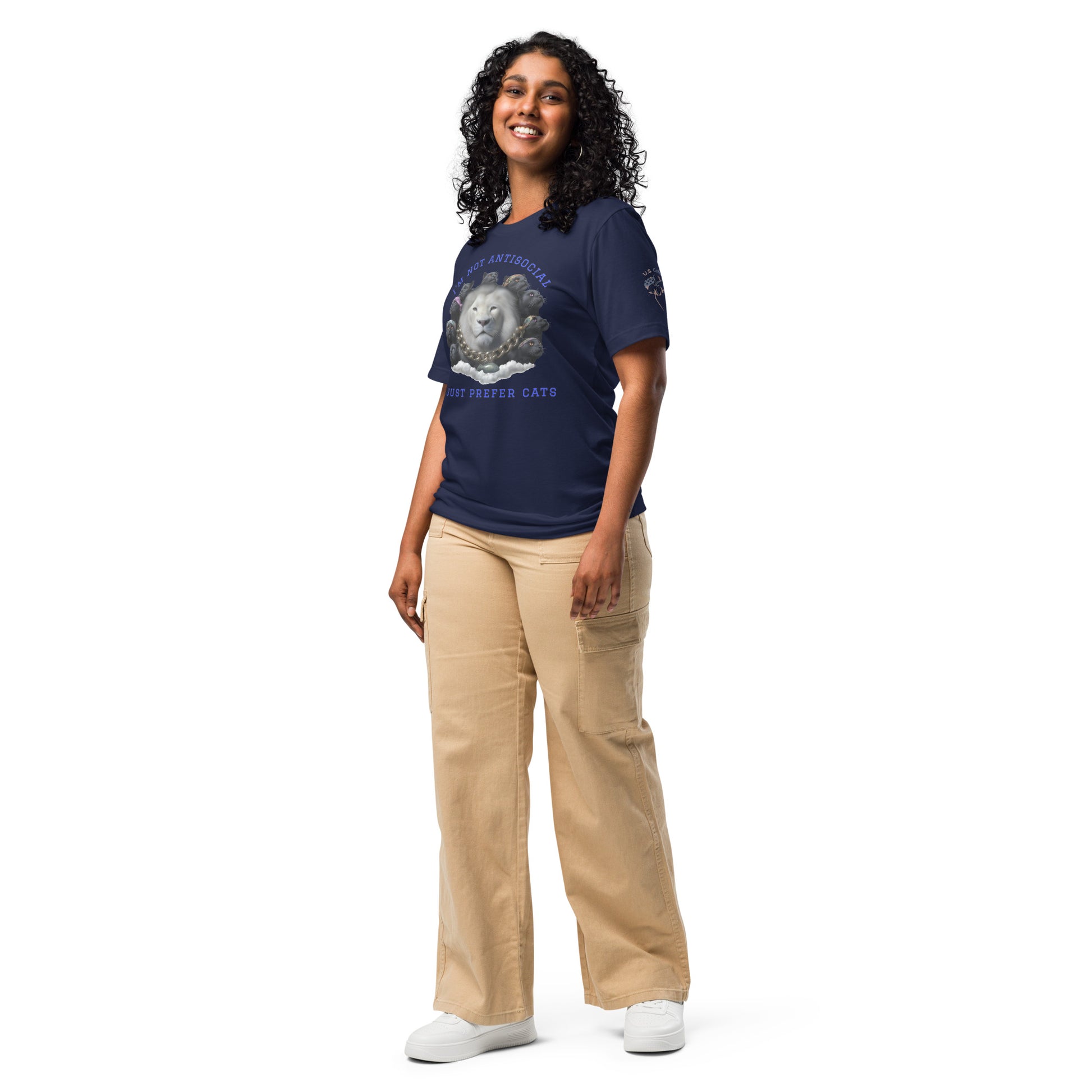 Product mockup. Smiling woman standing, wearing a navy blue T-shirt with a white lion, black panther heads, a gold chain, and the text "I'M NOT ANTISOCIAL — I JUST PREFER CATS"