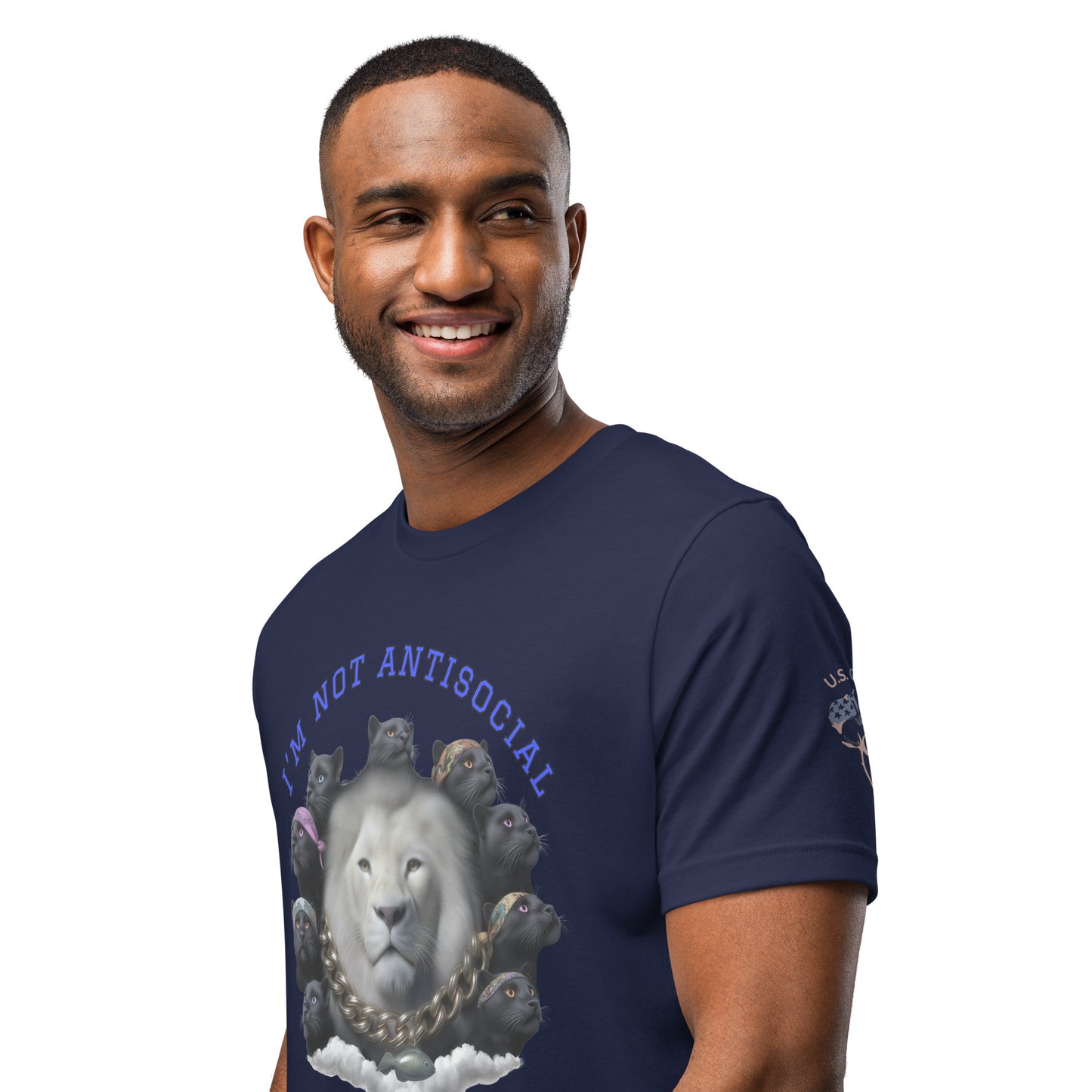 Product mockup. Smiling man wearing a navy blue T-shirt showing a large white lion surrounded by black panther heads, a gold chain, and the text "I'M NOT ANTISOCIAL"