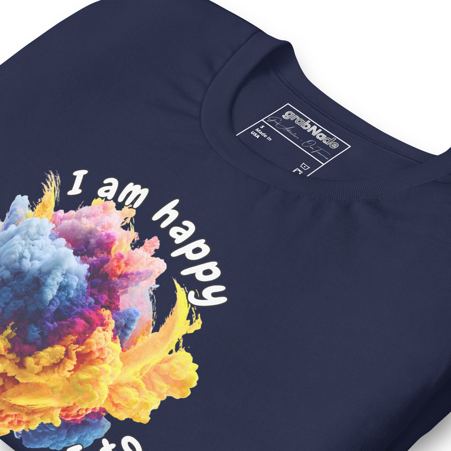 Product mockup. Navy blue T-shirt, zoomed in, bright cloud-like smoke in yellow, purple, and blue; text: “I am happy. That’s it.”